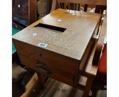 A vintage oak shop till by G.H. Gledhill with bell mechanism to drawer