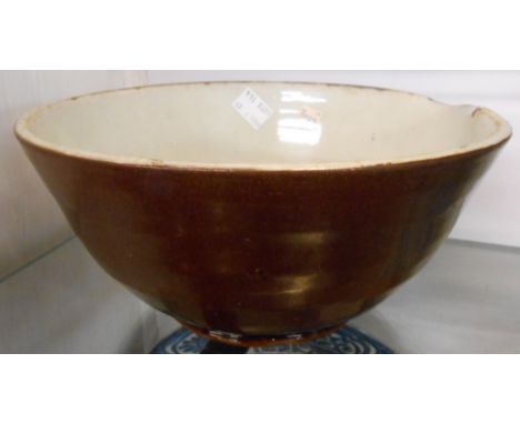 A 19th Century Welsh style pottery dairy cream pan with lead treacle exterior glaze and light green interior