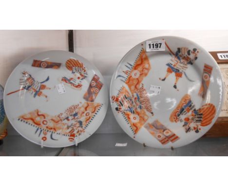 A pair of antique Chinese porcelain plates with iron red figural decoration