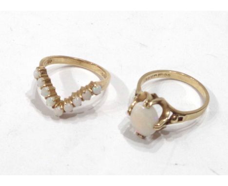 A 375 (9ct.) gold opal panel ring - sold with a 9ct. opal set wishbone pattern ring - sizes P 1/2 and O 1/2 respectively