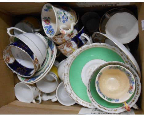 A box containing a quantity of assorted ceramic cups and saucers including Masons Strathmore, Limoges, etc.