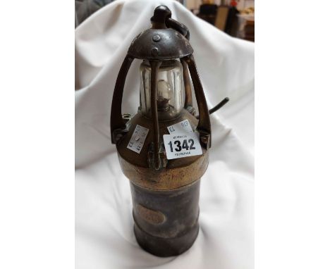 An early 20th Century miner's safety lamp of brass and steel construction