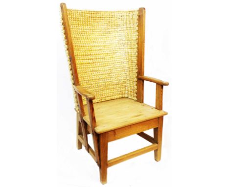 A 20th Century pine framed Orkney chair with woven rush and bound curved back and solid seat panel, set on square supports