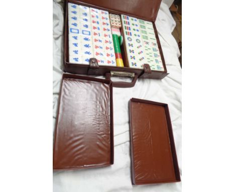 A vintage mahjong set in original vinyl briefcase style case