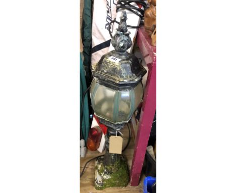 A modern garden lamp in the form of a streetlamp