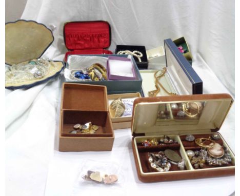 A bag containing a large quantity of boxed and loose costume jewellery, also a pair of 375 (9ct.) gold cufflinks, 9ct cufflin