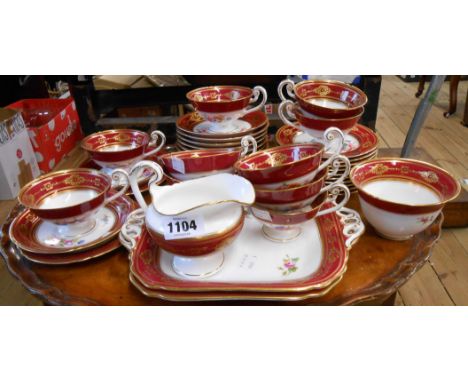 A Royal Worcester part tea set decorated with hand painted floral sprays with burgundy and gilt banding comprising ten trios,