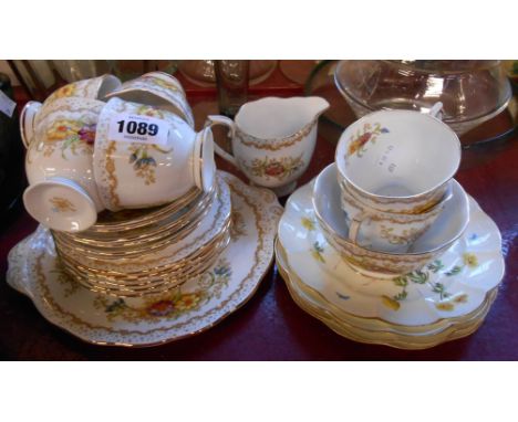 A Royal Albert bone china part tea set in the Gem pattern comprising six trios, milk and sugar and bread and butter plate - s