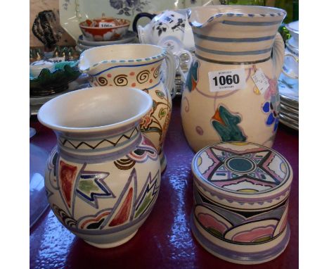 Four pieces of Honiton pottery comprising two jugs, vase with unusual abstract decoration and a small lidded pot