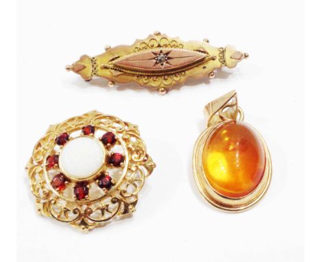 A 375 (9ct.) gold mourning brooch - sold with a 375 garnet and opal panel brooch and a 375 (9ct.) gold framed amber cabochon 