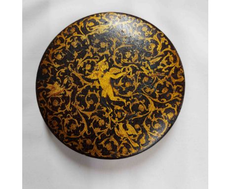 An early 19th Century papier mache snuff box with all over gilt decoration depicting a cherub amongst foliage with exotic bir