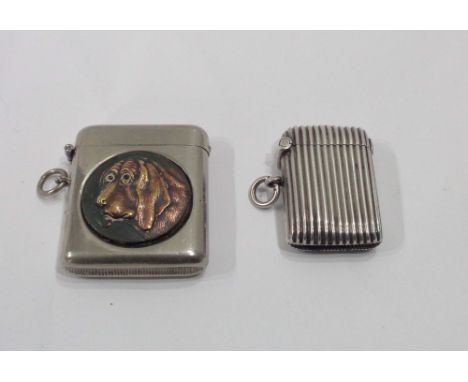 A silver flip-top vesta case with ribbed decoration - Birmingham 1924 - sold with a plated similar with applied Bassett hound