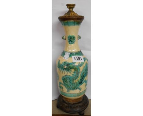 A continental pottery vase decorated in sgrafitto with a dragon in the Chinese style on a yellow tin glazed ground - adapted 