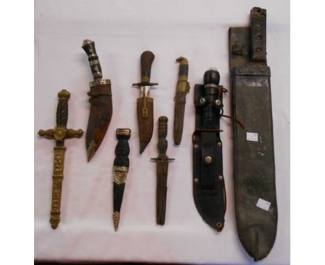 A box containing a quantity of assorted knives including Eastern and other examples - sold with a machete in leather scabbard