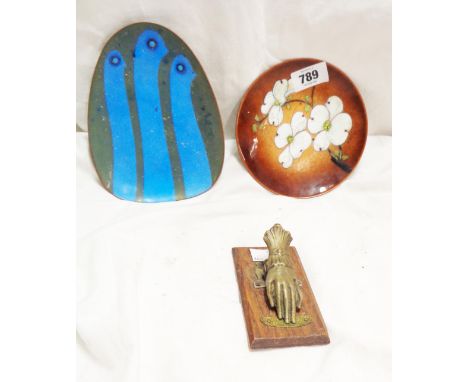 An early 20th Century pressed brass letter clip of hand form - sold with two vintage enamel on copper dishes
