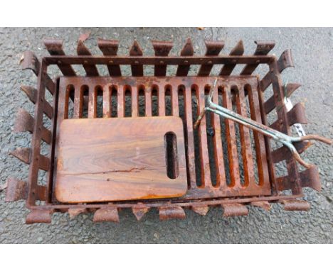 A wrought iron fire grate