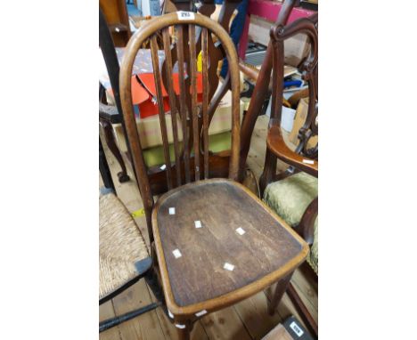 An antique bentwood hoop stick back dining chair, set on tapered legs