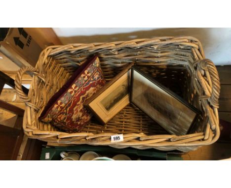 A two handled wicker log basket of oblong form containing two antique prints of Tavistock and a tapestry cushion - sold with 