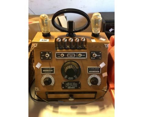 A Spirit of St. Louis wireless valve radio cassette with wooden case, retro style switches and visible light up valves - sold