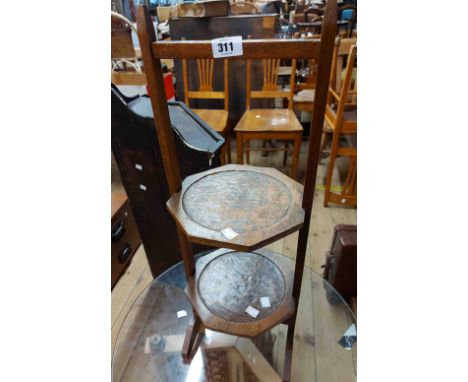 A vintage stained wood rustic two tier cake stand