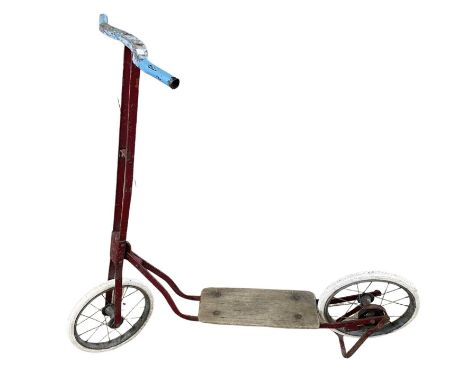 A vintage childrens' scooter.