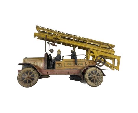 A German tinplate Fire engine, with original ladder, firefighters and key.