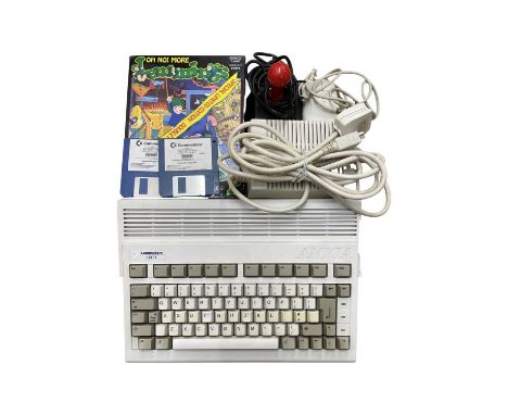 A 1992 Commodore A600 Amiga console, with accessories to include: - Power pack - Mouse - Joystick - Lemmings / Pushover games