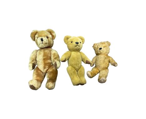 A trio of vintage teddy bears, to include: - A Merry Thoughy teddy - A Pedigree teddy with growling and bear sounds - A small