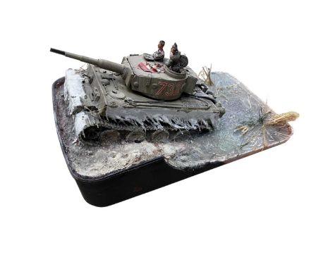 A painted German Tiger tank model on resin-based diorama.