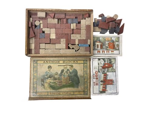 A wooden-boxed set of Anchor Blocks masonry building pieces, with original instructions and architectural design to lid