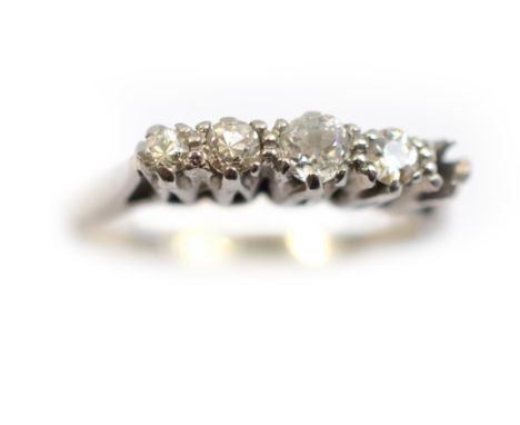 A diamond set ring stamped 18ct plat, the four old cut diamonds total approx 0.24cts (one diamond missing), size L, approx 2.