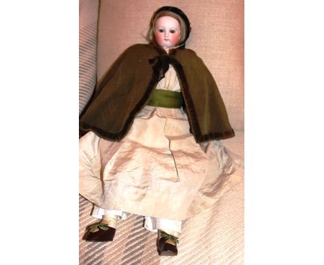 Early French bisque head fashion doll, possibly Simonne, Circa 1870, with pale bisque head, fixed blue glass eyes, closed mou