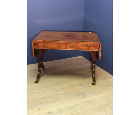 Regency mahogany crossbanded sofa table on down swept reeded end supports, 157cm fully extended