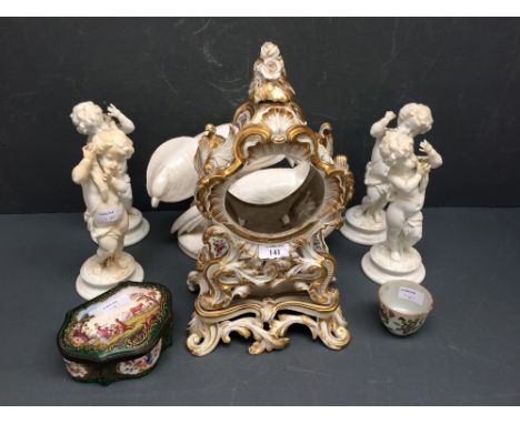 C19th rococo style porcelain floral painted mantel clock case, a set of four cherubic figures, a cloisonné box and a Chinese 