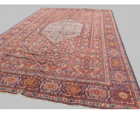 c.1920 oriental carpet with all over geometric pattern and border in red, blue and orange 2.92 x 2 m