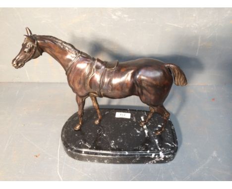 French School, a bronze figure of a Stallion under saddle, raised on a marble base, 26cmH