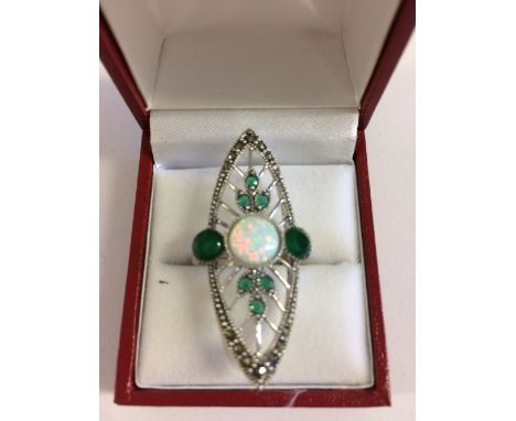 Silver ring set with cubic zirconia's, emeralds and a central opal in the Art Deco style