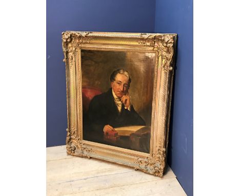 English School - Portrait of Revd Canon John Mervyn Prower, seated at a desk with books, half length, oil on canvas, 90x70cm 