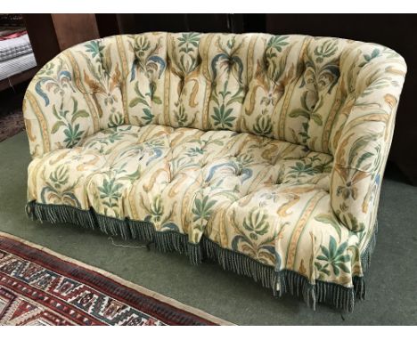 Large Chesterfield style, crescent shaped, button backed  horsehair sofa in floral upholstery, three brass castors stamped Ho