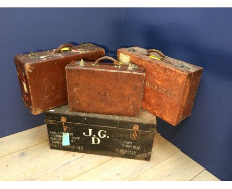 An Army & Navy leather suitcase, a canvas suitcase retailed by Harrods & another suitcase  a tin trunk and a Wall Hanging