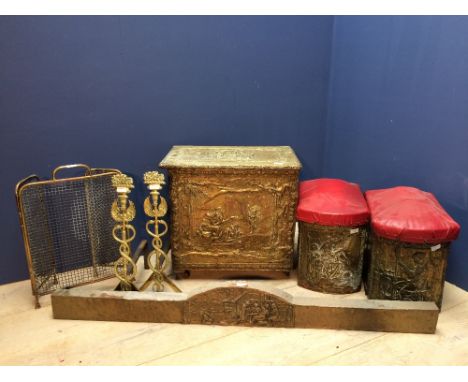 Brass log bin with embossed decoration, fireguard, a pair of andirons & 2 further brass bins with padded seats