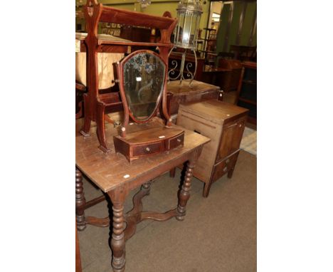 A 19th century mahogany shield form toilet mirror and a two tier book trough (2) 