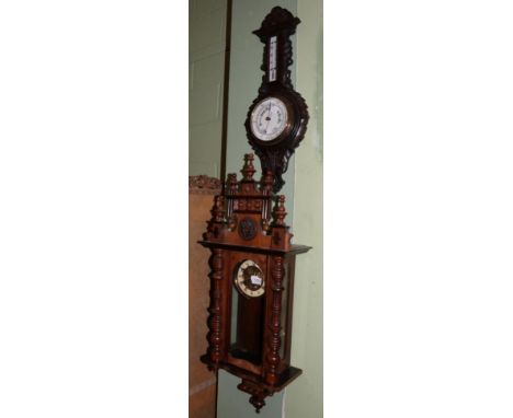 A Vienna type striking wall clock and a carved oak cased aneroid barometer (2)