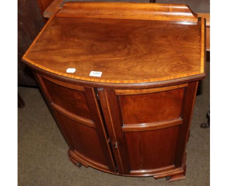 A crossbanded mahogany bow fronted two door cabinet 