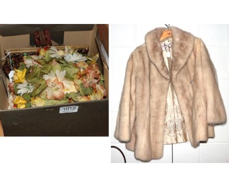 A mink coat; a floral hat with label marked Christian Dior; and a costume clutch bag 