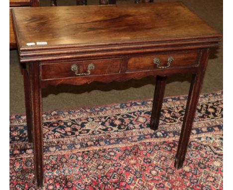 A George III mahogany double foldover tea and card table, 3rd quarter 18th century, of rectangular form with two frieze drawe