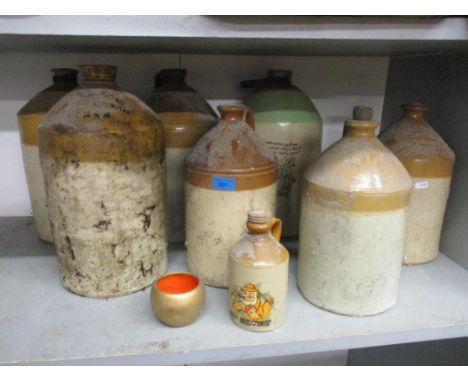 A mixed lot to include a group of stoneware flagons and bottles to include one advertising for William Barker & Sons of Londo