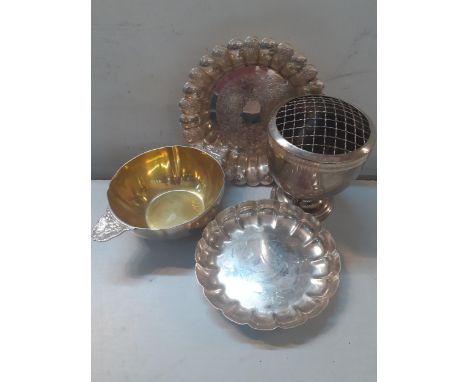 A small quantity of silver plated items to include an ornate Barker Ellis dish and a Christofle tastevin and an engine turned