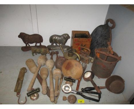 A mixed lot of kitchenalia and other household implements to include a matched pair of cast iron mantle ornaments in the form