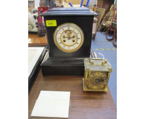 A Samuel Marti black slate cased mantel clock, the white enamel Roman dial with visible brocot escapement (with key and pendu